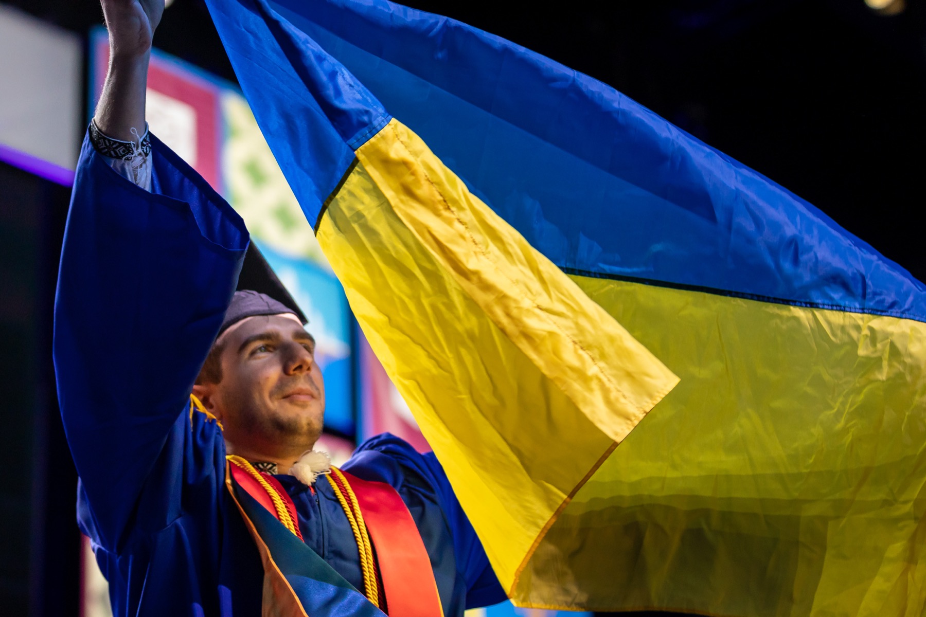 In a show of solidarity, a graduate unfurled a Ukrainian flag on stage.